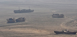 Ships lay stranded in a dry reservoir in China.