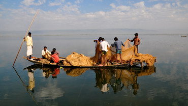 A group of fishermen on a boat in Bangladesh