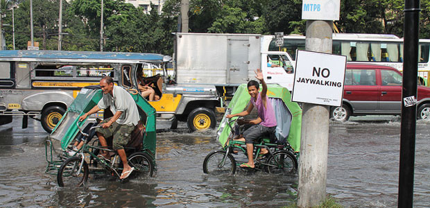 Pedicabs on the flooded streets of Manila, Philippines. 