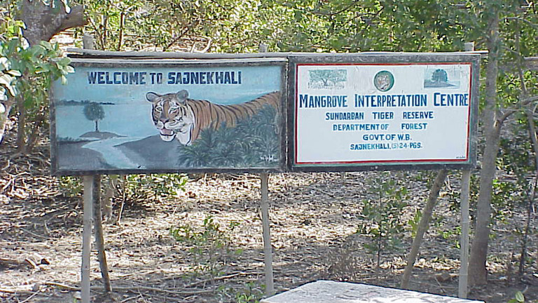 Signs welcome visitors to the Sunderban Tiger Reserve in India. Wandering tigers still kill humans in the region, but this reserve generates employment and ecosystem benefits and other income for local people (Rick Hobson, Creative Commons via Flickr)