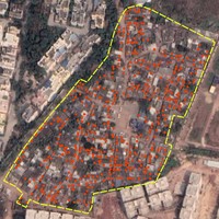 Aerial view of residential area with red spots and a yellow outline